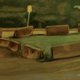 painting of concrete road barriers in a circle in a small grassy area